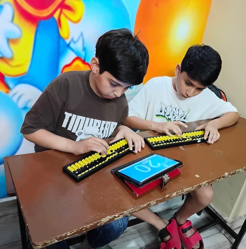 Children practicing abacus in class
